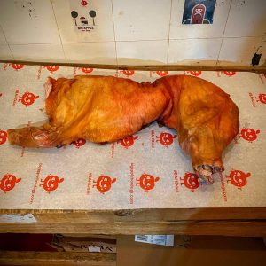 1-2-suckling-Pig-Royale-head-off-on-Butchers-block